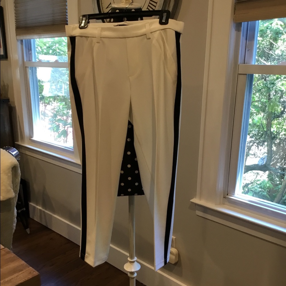 White pants with black stripe